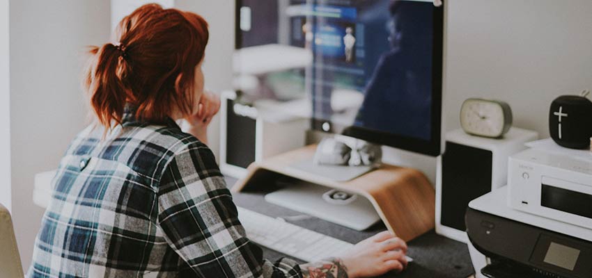 A woman using a computer.